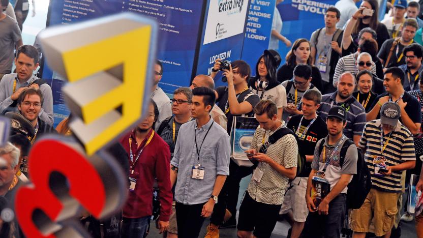 Gamers and trade representatives wait to enter on the opening day of the Electronic Entertainment Expo, known as E3 at the Convention Center in Los Angeles, California on June 16, 2015.  Console kings Microsoft and Sony battled for players' hearts with blockbuster games and the lure of virtual worlds as the annual Electronic Entertainment Expo began in Los Angeles.  