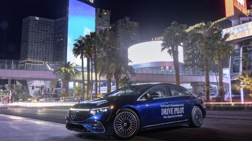 long exposure shot of a blue Mercedes S class with the drive pilot log stenciled across the door panels parked on the side of Las Vegas Blvd (across the street from the Aria hotel) at night