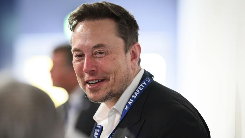 Tesla and SpaceX's CEO Elon Musk speaks with other delegates during the first plenary session on of the AI Safety Summit at Bletchley Park, on Wednesday, Nov. 1, 2023 in Bletchley, England. Digital officials, tech company bosses and researchers are converging Wednesday at a former codebreaking spy base near London to discuss and better understand the extreme risks posed by cutting-edge artificial intelligence. (Leon Neal/Pool Photo via AP)