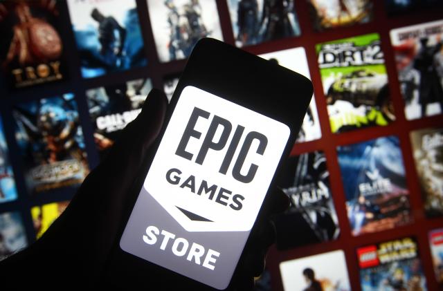 KIEV, UKRAINE - 2021/12/27: In this photo illustration, Epic Games logo of a video game and software developer is seen on a smartphone screen. (Photo Illustration by Pavlo Gonchar/SOPA Images/LightRocket via Getty Images)