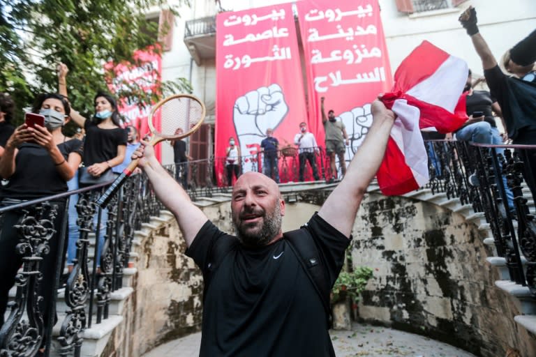 With security forces focused on a large gathering at the Martyrs' Square protest hub, a group led by retired army officers snuck into the foreign ministry and declared the building a 'headquarters of the revolution'