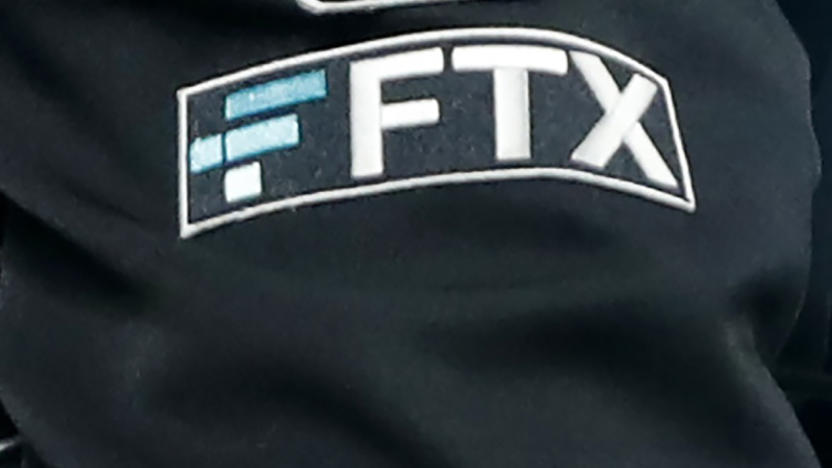 FILE - The FTX logo appears on home plate umpire Jansen Visconti's jacket at a baseball game with the Minnesota Twins on Sept. 27, 2022, in Minneapolis. Failed cryptocurrency exchange FTX says that nearly all of its customers will receive the money back that they are owed, and some will get more than that, according to its reorganization plan. FTX said in a court filing Tuesday, May 7, 2024 that it owes about $11.2 billion to its creditors. (AP Photo/Bruce Kluckhohn, File)