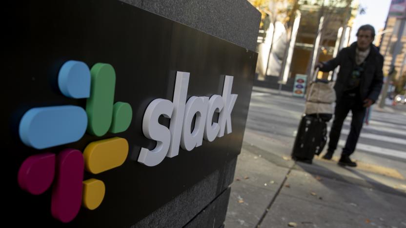 SAN FRANCISCO, CA - DECEMBER 01: A pedestrian walks past a Slack logo outside its headquarters on December 1, 2020 in San Francisco, California. Cloud-based enterprise software company Salesforce announced on Tuesday that it will purchase the popular workplace-chat app for $27.7 billion. (Photo by Stephen Lam/Getty Images)