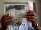 Rupee edges up but importer dollar demand likely to limit upside