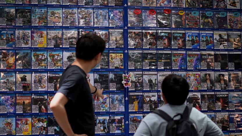 People look at console games at a store in Beijing on August 31, 2021, a day after China announced a drastic cut to children's online gaming time to just three hours a week in the latest move in a broad crackdown on tech giants. (Photo by Noel Celis / AFP) (Photo by NOEL CELIS/AFP via Getty Images)