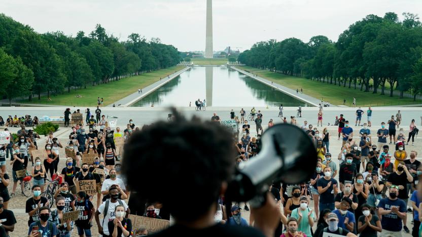 Protesters applaud during a rally against racial inequality in the aftermath of the death in Minneapolis police custody of George Floyd, at the Lincoln Memorial in Washington, U.S., June 10, 2020. REUTERS/Erin Scott