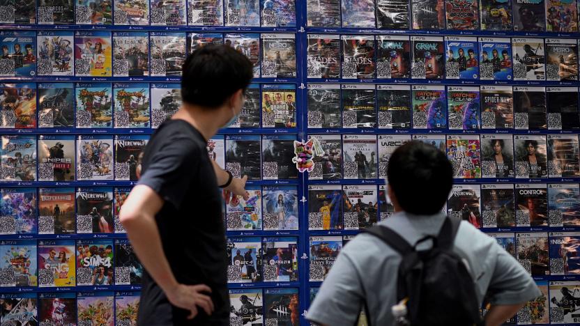 People look at console games at a store in Beijing on August 31, 2021, a day after China announced a drastic cut to children's online gaming time to just three hours a week in the latest move in a broad crackdown on tech giants. (Photo by Noel Celis / AFP) (Photo by NOEL CELIS/AFP via Getty Images)