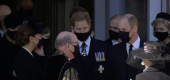 Prince Harry, center, Prince William, right, and Kate Middleton, left, were spotted talking after the service. (BBC)
