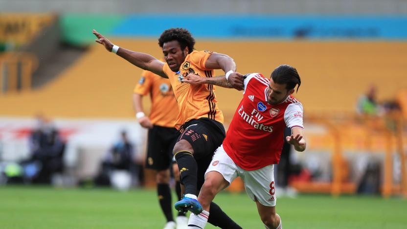 WOLVERHAMPTON, ENGLAND - JULY 04: Adama Traore of Wolverhampton Wanderers and Dani Ceballos of Arsenal battle for the ball during the Premier League match between Wolverhampton Wanderers and Arsenal FC at Molineux on July 04, 2020 in Wolverhampton, England. Football Stadiums around Europe remain empty due to the Coronavirus Pandemic as Government social distancing laws prohibit fans inside venues resulting in all fixtures being played behind closed doors. (Photo by Mike Egerton/Pool via Getty Images)