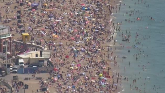 Sun Seekers Flock To Camber Sands And Brighton Beach