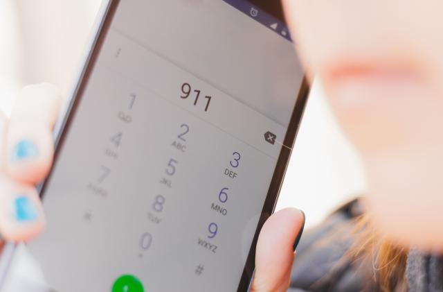 Smartphone screen with the emergency number 911 dialed – Person calling the support service phone line asking for help