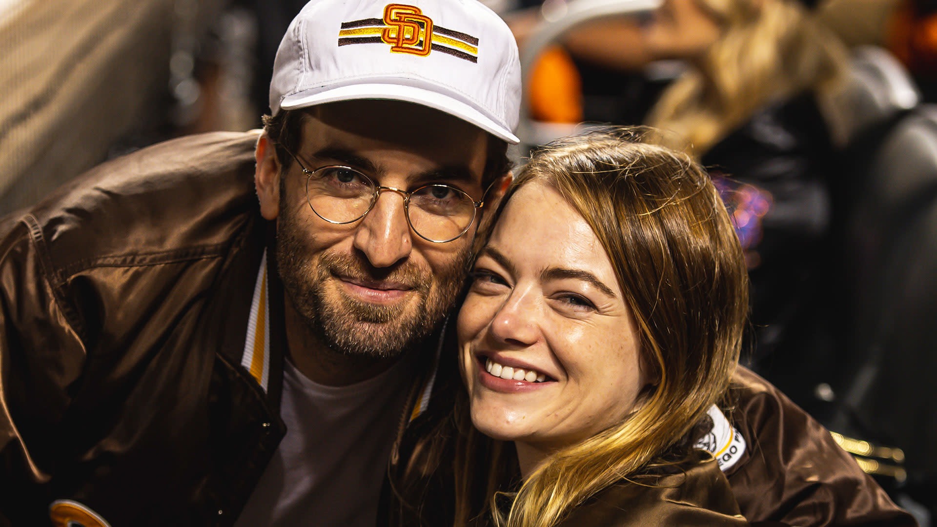 Emma Stone, husband Dave McCary pose for photos at Padres game