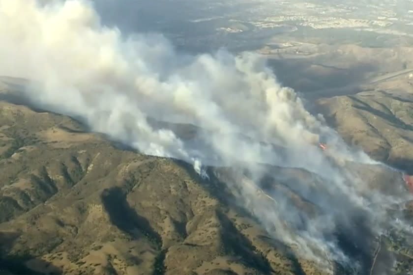 Orange County under siege by wildfires; 2 firefighters gravely burned
