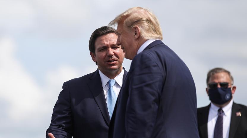 U.S. President Donald Trump is greeted by Florida Governor Ron Desantis as he arrives at Southwest Florida International Airport ahead of a campaign stop in Fort Myers, Florida, U.S., October 16, 2020. REUTERS/Carlos Barria