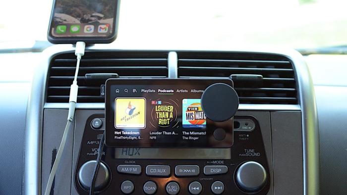 Review photo of the Spotify Car Thing, mounted on a center console above the head unit.