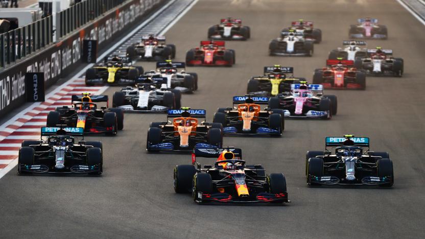 ABU DHABI, UNITED ARAB EMIRATES - DECEMBER 13: Max Verstappen of the Netherlands driving the (33) Aston Martin Red Bull Racing RB16 leads Lewis Hamilton of Great Britain driving the (44) Mercedes AMG Petronas F1 Team Mercedes W11 and Valtteri Bottas of Finland driving the (77) Mercedes AMG Petronas F1 Team Mercedes W11 into turn one at the start during the F1 Grand Prix of Abu Dhabi at Yas Marina Circuit on December 13, 2020 in Abu Dhabi, United Arab Emirates. (Photo by Dan Istitene - Formula 1/Formula 1 via Getty Images)
