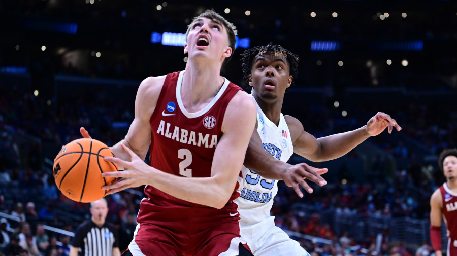 Getty Images - LOS ANGELES, CALIFORNIA - MARCH 28: Grant Nelson #2 of the Alabama Crimson Tide looks to shoot against Harrison Ingram #55 of the North Carolina Tar Heels during the Sweet Sixteen round of the 2024 NCAA Men's Basketball Tournament held at Crypto.com Arena on March 28, 2024 in Los Angeles, California. (Photo by Ben Solomon/NCAA Photos via Getty Images)