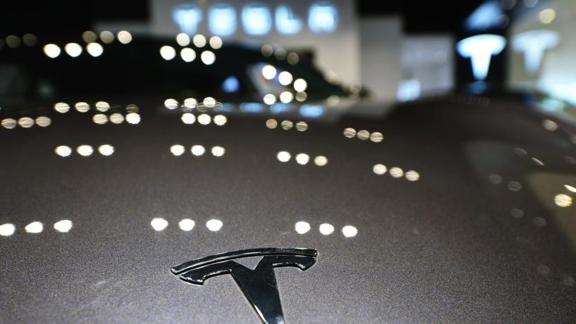 HANGZHOU, CHINA - APRIL 21: A Tesla logo is seen on a vehicle at a Tesla store on April 21, 2020 in Hangzhou, Zhejiang Province of China. (Photo by Long Wei/VCG via Getty Images)