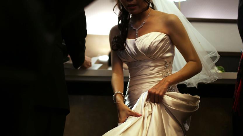 NEW YORK, NY - DECEMBER 12:  A bride waits to fill out marriage papers at a busy City Clerk's office on December 12, 2012 in New York City. Couples around the world are hoping that a once-in-a-lifetime event, the date 12/12/12, will bring added luck to their marriages if they tie the knot today. This will be the last such triple date for almost a century, until January 1, 2101.  (Photo by Spencer Platt/Getty Images)