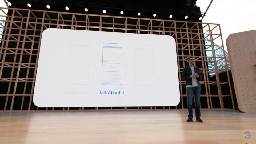 Google CEO Sundar Pichai on stage at Google IO 2022 in front of a screen showing the AI Test Kitchen app.