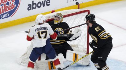 Associated Press - Florida Panthers' Evan Rodrigues (17) sets up to score on the rebound against Boston Bruins' Jeremy Swayman as Brandon Carlo (25) defends during the first period in Game 3 of an NHL hockey Stanley Cup second-round playoff series, Friday, May 10, 2024, in Boston. (AP Photo/Michael Dwyer)