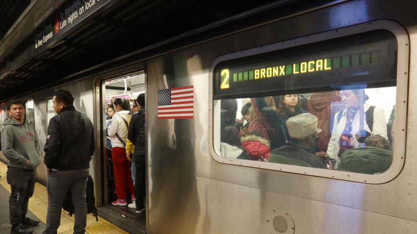 NEW YORK, NY - NOVEMBER 6: Two people wait on a platform to board a 2 train at the Times Sqaure subway station on November 6, 2023, in New York City.  (Photo by Gary Hershorn/Getty Images)