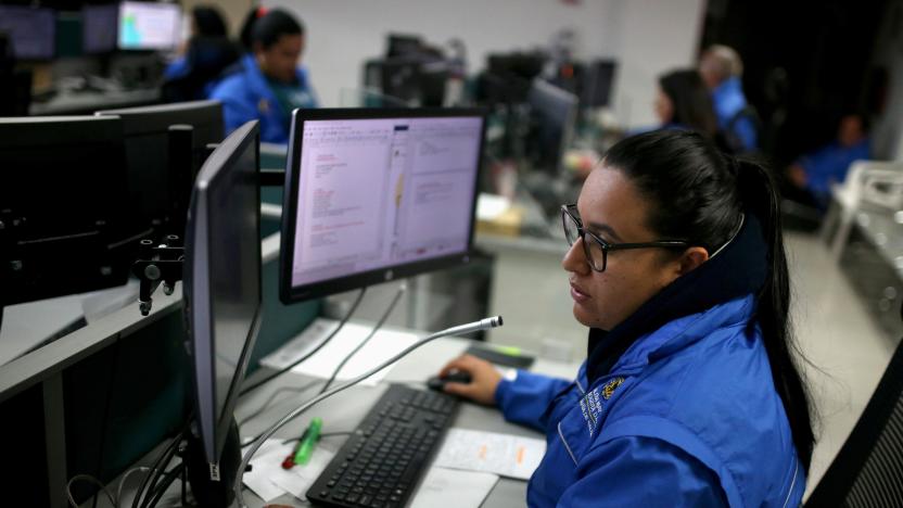 An employee of the city's health emergency number call center takes a call, amid the coronavirus disease (COVID-19) outbreak in Bogota, Colombia April 1, 2020. Picture taken April 1, 2020. REUTERS/Luisa Gonzalez