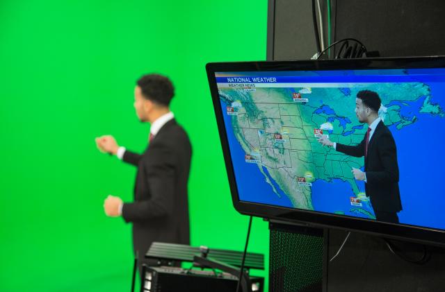 Weather presenter explaining about weather forecast.