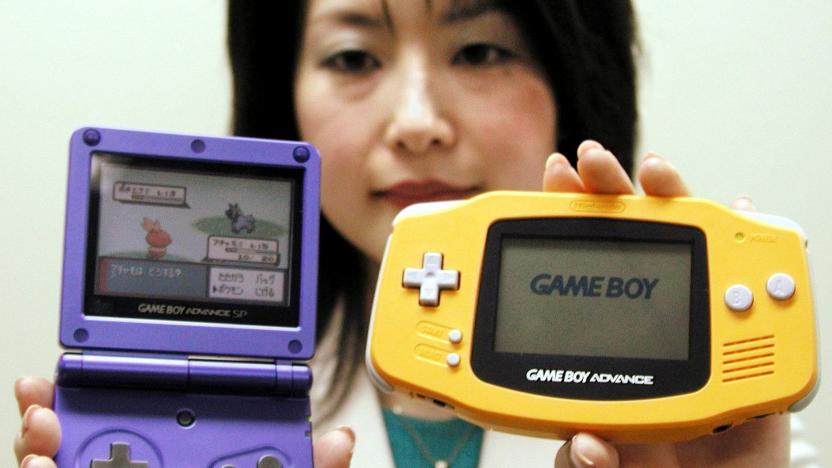 A Nintendo Co employee displays the company's new Game Boy Advance SP (L) and the current version in Osaka, western Japan, on January 7, 2003. Japan's videogame giant said on Tuesday that it would launch the premium version of its Game Boy Advance hand-held videogame player, which can be folded and has a lighting system that allows it to be used in poorly lit places, on February 14 for 12,500 yen ($105) in Japan.