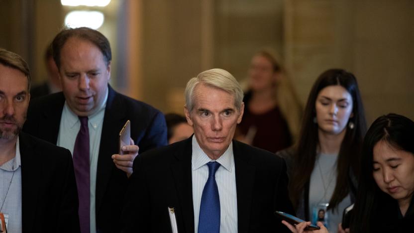 Senator Rob Portman (R-OH) walks along news reporters before attending a vote, on Capitol Hill in Washington, U.S., June 23, 2021.  REUTERS/Tom Brenner