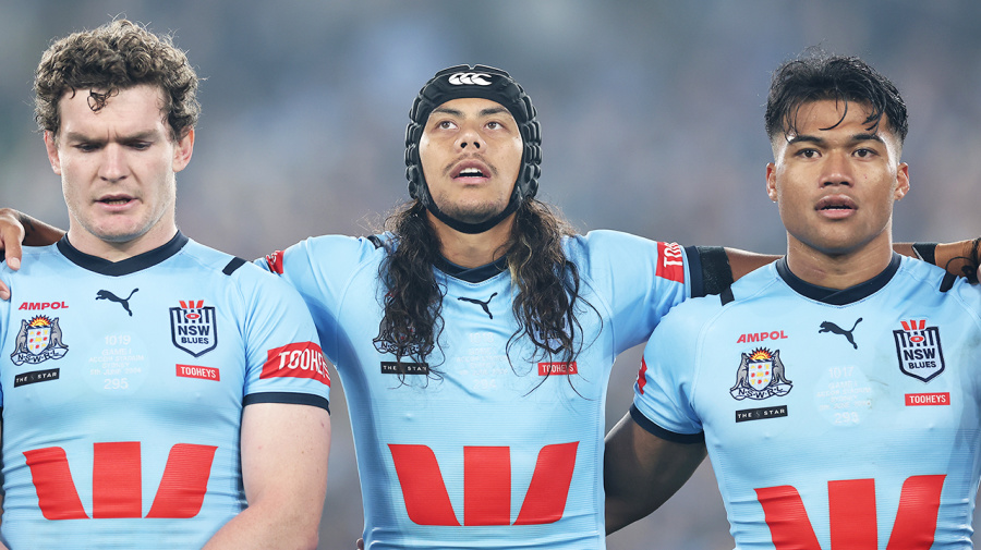 Getty Images - SYDNEY, AUSTRALIA - JUNE 05:  Liam Martin, Jarome Luai and Brian To'o of the Blues sing the national anthem before game one of the 2024 Men's State of Origin Series between New South Wales Blues and Queensland Maroons at Accor Stadium on June 05, 2024 in Sydney, Australia. (Photo by Cameron Spencer/Getty Images)