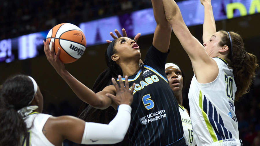 Getty Images - ARLINGTON, TEXAS - MAY 15: Angel Reese #5 of the Chicago Sky drives to the basket against the Dallas Wings during the first half at the College Park Center on May 15, 2024 in Arlington, Texas. NOTE TO USER: User expressly acknowledges and agrees that, by downloading and or using this photograph, User is consenting to the terms and conditions of the Getty Images License Agreement.  (Photo by Cooper Neill/Getty Images)