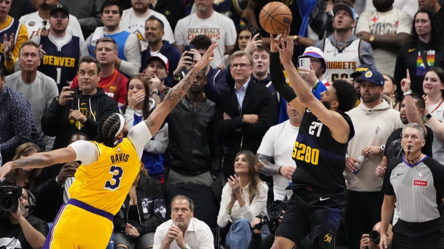 Associated Press - Denver Nuggets guard Jamal Murray (27) hits the game-winning basket against Los Angeles Lakers forward Anthony Davis (3) during the second half in Game 2 of an NBA basketball first-round playoff series Monday, April 22, 2024, in Denver. (AP Photo/Jack Dempsey)