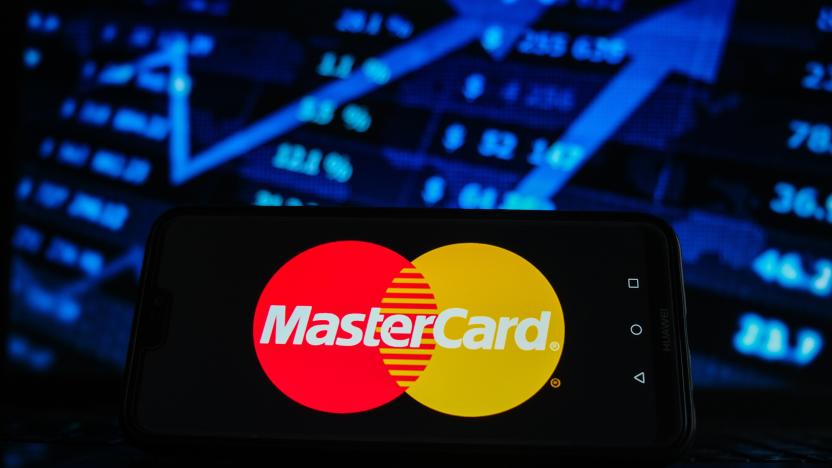 POLAND - 2021/02/05: In this photo illustration a Mastercard logo seen displayed on a smartphone screen with stock market graphic on the background. (Photo Illustration by Omar Marques/SOPA Images/LightRocket via Getty Images)