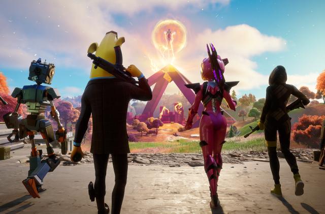 Screenshot of four Fortnite characters wielding weapons as they walk toward The Cube Queen, a figure floating above a structure in the distance.