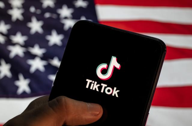 CHINA - 2021/04/02: In this photo illustration the Chinese video-sharing social networking service company TikTok logo is seen on an Android mobile device with United States of America (USA), commonly known as the United States (U.S. or US), flag in the background. (Photo Illustration by Budrul Chukrut/SOPA Images/LightRocket via Getty Images)