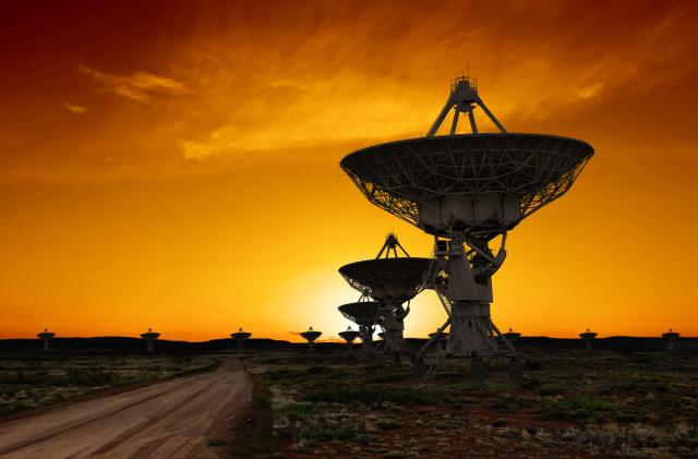 large radio telescopes in silhouette at sunset (XL)