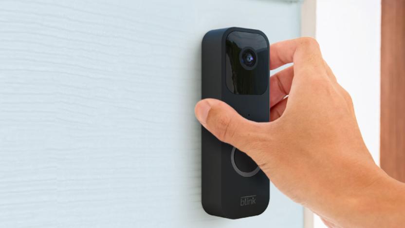 The Blink video doorbell is being installed wirelessly on a house to the side of the front door.  