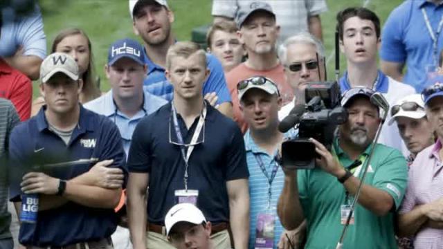 Rory McIlroy bounces a ridiculous shot along a cart path and through a bunker