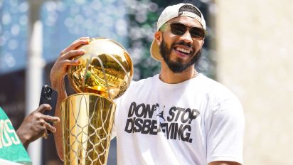 Getty Images - Boston, MA - June 21: Boston Celtics SF Jayson Tatum celebrates during a duck boat parade to celebrate the 18th Boston Celtics NBA championship. (Photo by Kayla Bartkowski/The Boston Globe via Getty Images)