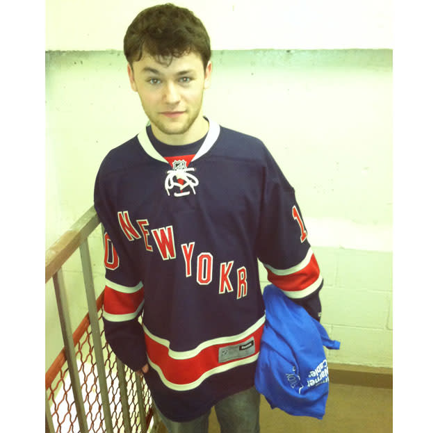 wearing hockey jersey