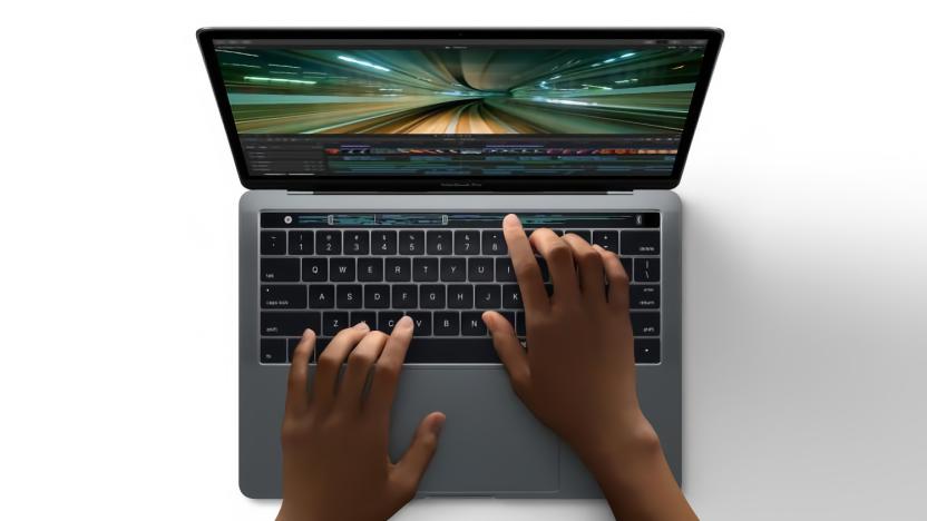 Apple marketing photo of a MacBook Pro with Touch Bar. A person's hands are on the keyboard and Touch Bar.