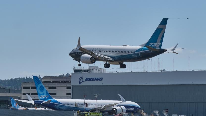 SEATTLE, WA - JUNE 29: A Boeing 737 MAX aircraft lands following a FAA recertification flight at Boeing Field on June 29, 2020 in Seattle, Washington. The 737 MAX has been grounded for commercial flights since March of 2019 following two crashes. In the background is a Boeing 777X test plane. (Photo by Stephen Brashear/Getty Images)