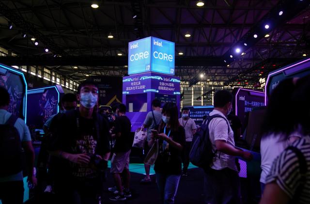 Visitors are seen at the Intel booth during the China Digital Entertainment Expo and Conference, also known as ChinaJoy, in Shanghai, China July 30, 2021. Picture taken July 30, 2021. REUTERS/Aly Song