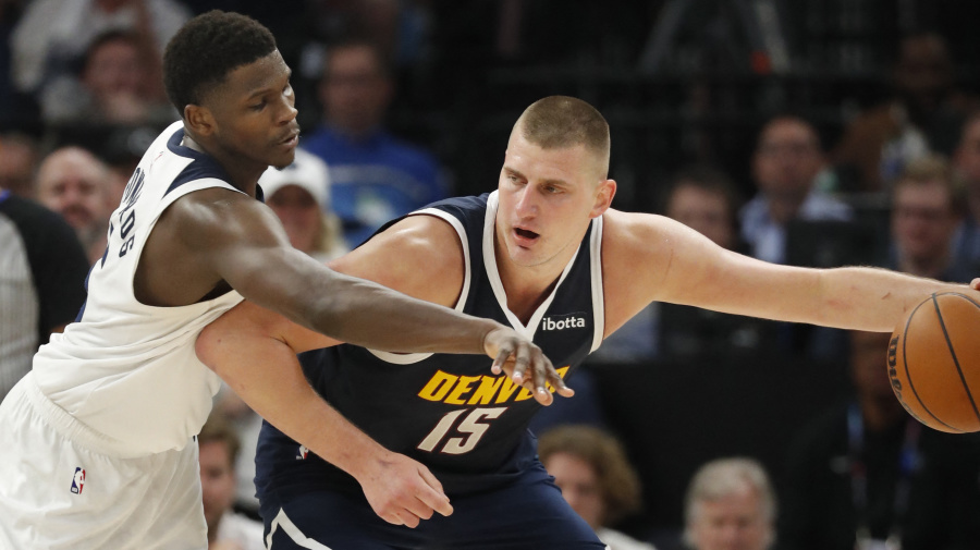 Reuters - May 12, 2024; Minneapolis, Minnesota, USA; Denver Nuggets center Nikola Jokic (15) works around Minnesota Timberwolves guard Anthony Edwards (5) in the fourth quarter of game four of the second round for the 2024 NBA playoffs at Target Center. Mandatory Credit: Bruce Kluckhohn-USA TODAY Sports