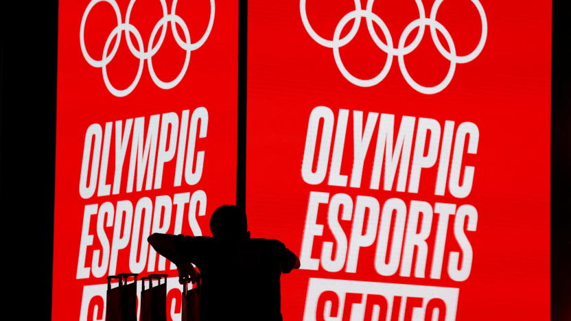 A crew member arranges trophies to be awarded at the Olympic Esports Week in Singapore June 23, 2023. REUTERS/Edgar Su