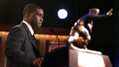 Associated Press - FILE - In this Dec. 10, 2005, file photo, Southern California tailback back Reggie Bush pauses while giving his acceptance speech as the winner of the Heisman Trophy award in New York. Bush said Tuesday, Tuesday, Sept. 14, 2010, that he is forfeiting his Heisman Trophy. (AP Photo/Julie Jacobson, File)