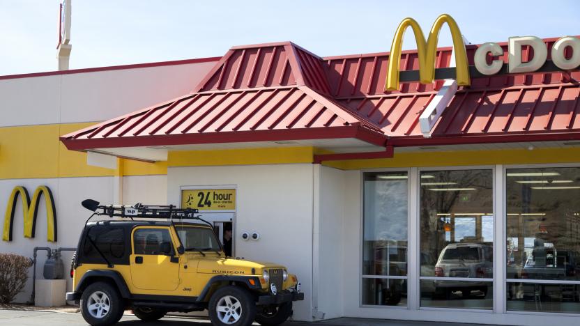 Salt Lake City, USA - February 26, 2013: Mcdonalds Drive thru service is amount one of the popular service in fast food chain restuarants, many stores open 24 hours. A yellow jeep pick up order at the drive thru window.