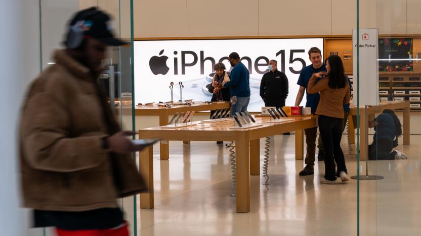 NEW YORK, NEW YORK - FEBRUARY 01: People walk by an Apple store in a shopping mall in lower Manhattan on February 01, 2024 in New York City. Apple will report earnings Thursday afternoon after the close of the Closing Bell. The iPhone maker, which is to release its Vision Pro mixed-reality headset on Friday, has seen revenue decline for each of its past four reported quarters. (Photo by Spencer Platt/Getty Images)