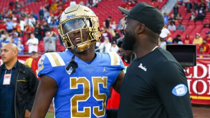 Getty Images - LOS ANGELES, CA - NOVEMBER 18: UCLA Bruins running back TJ Harden (25) gets a hug from UCLA Bruins coach DeShaun Foster during the UCLA Bruins vs USC Trojans game on November 18, 2023, at the Los Angeles Memorial Coliseum in Los Angeles, CA. (Photo by Jevone Moore/Icon Sportswire via Getty Images)